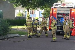 Kliko met oud papier in brand in Schagen