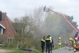 Brand in schoorsteen en dakkapel in Burgerbrug