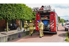 Bewoonster doet schuur open en ziet rookontwikkeling